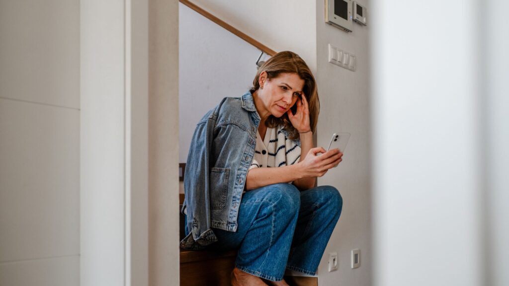 woman on stairs with phone